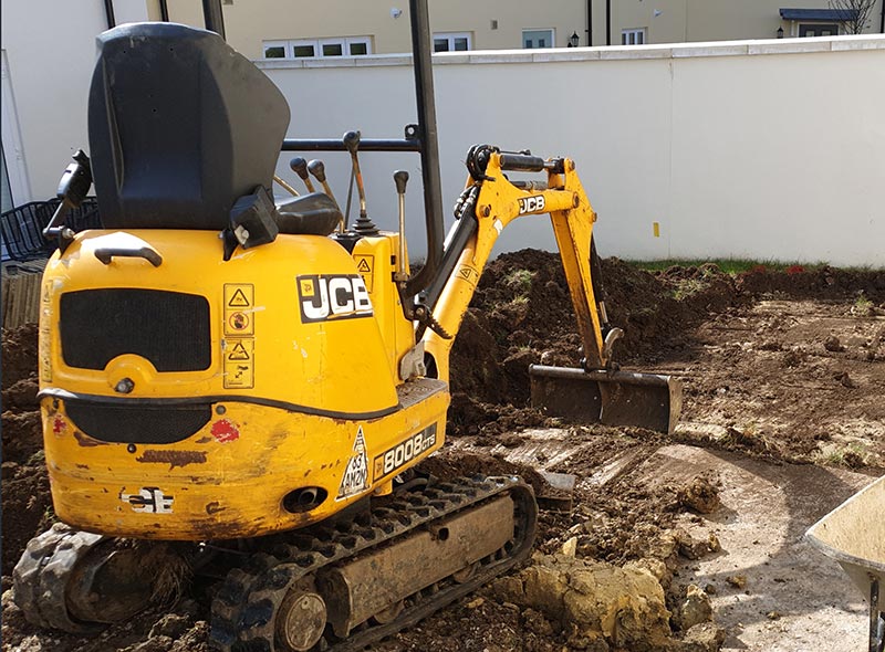 JCB Mini Digger in action for hire from Avon Valley Gardens